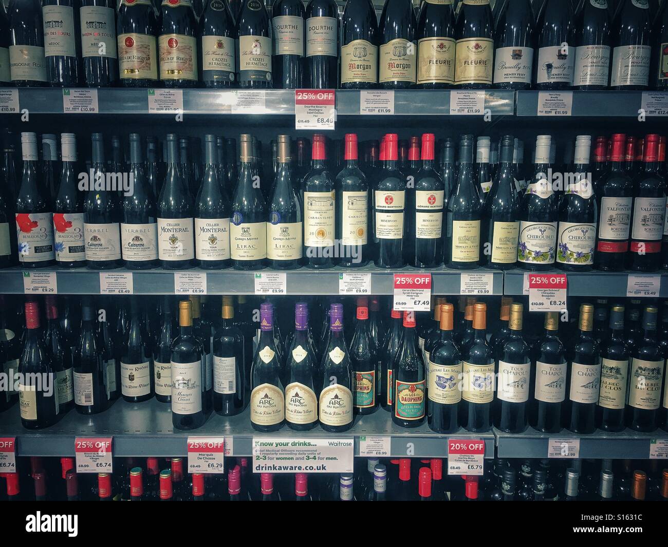 Wine bottles for sale on super market shelf Stock Photo