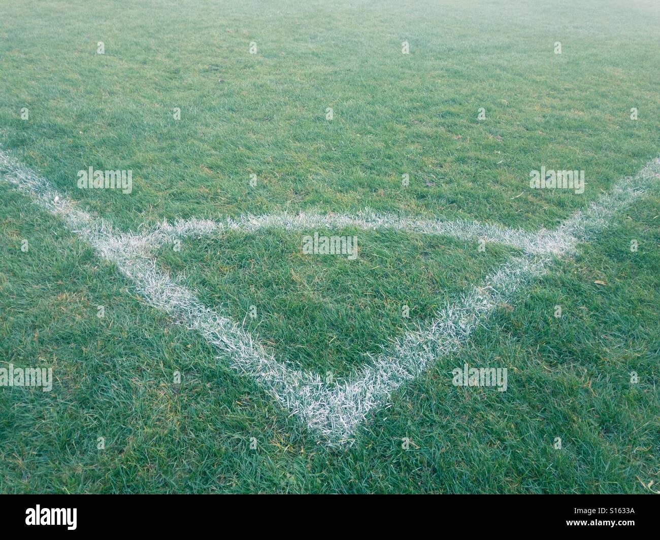 Corner arc of a British football pitch in fog Stock Photo