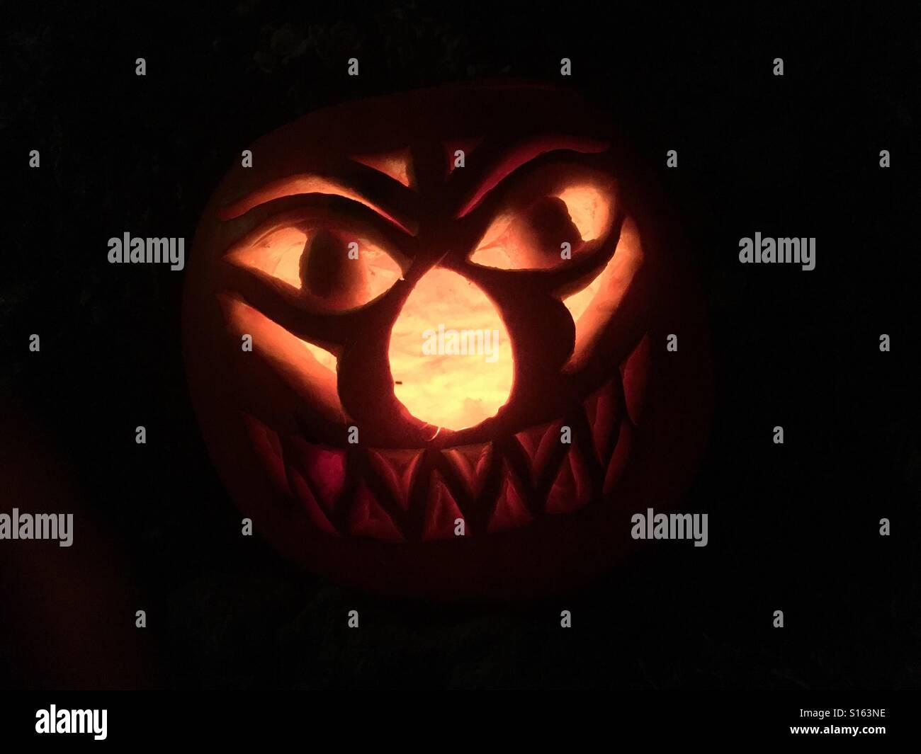 Halloween face on a pumpkin Stock Photo