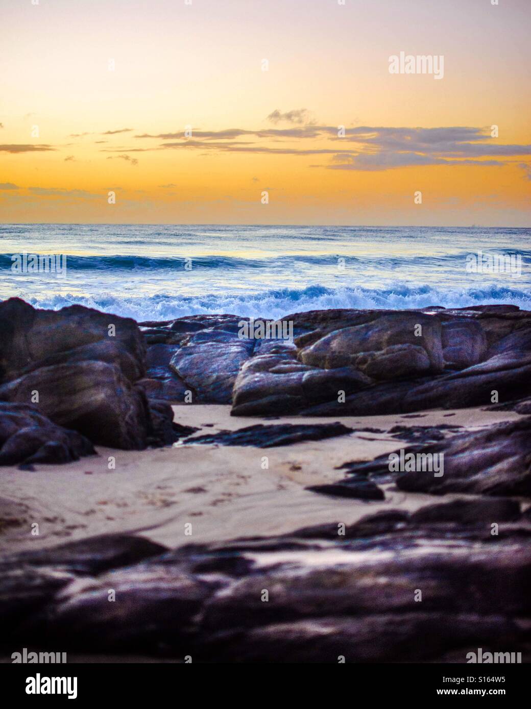 Beautiful sunrise rocky beach hi-res stock photography and images - Alamy