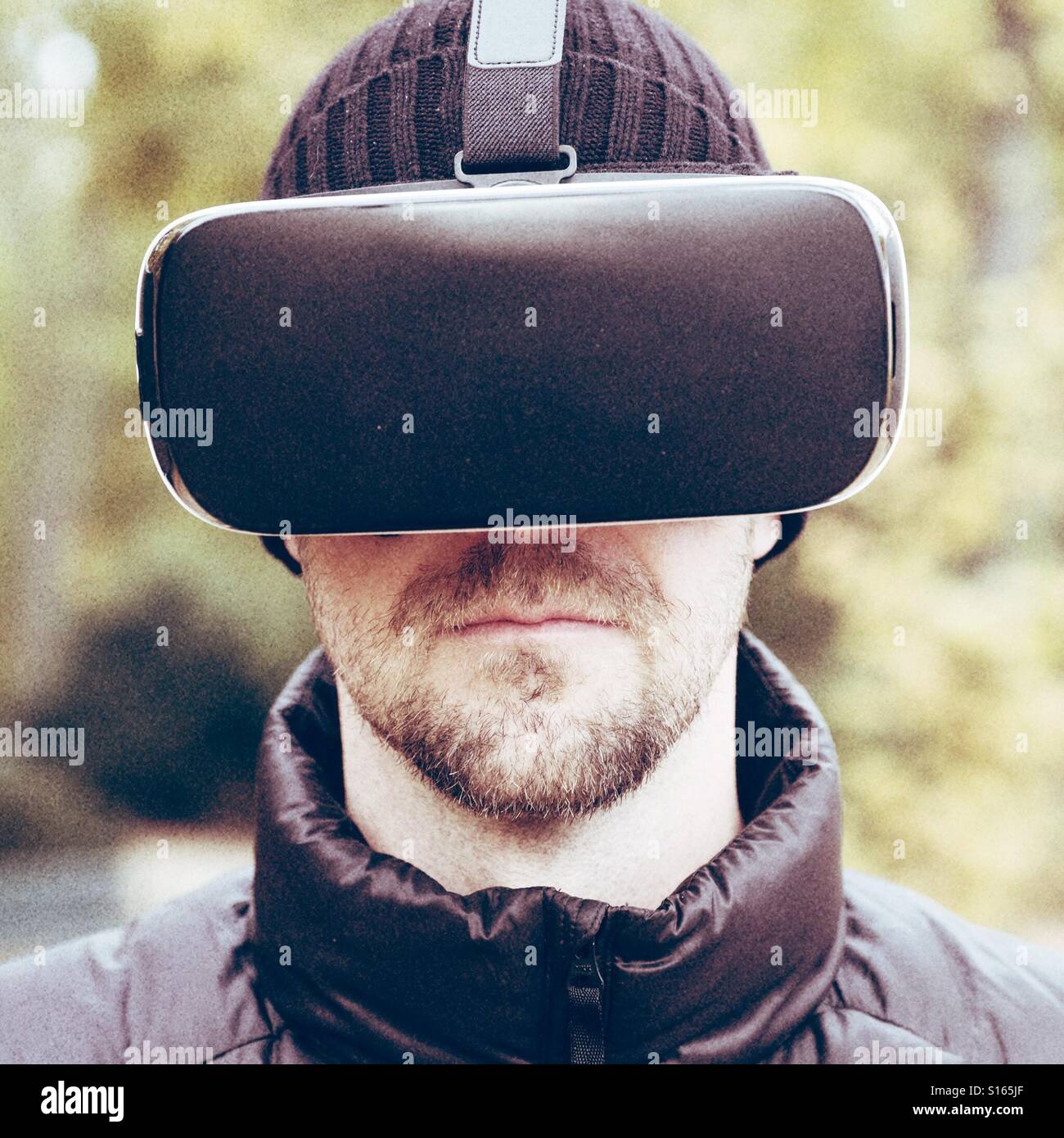 Man wearing VR virtual reality headset - Smartphone Captured Stock Image