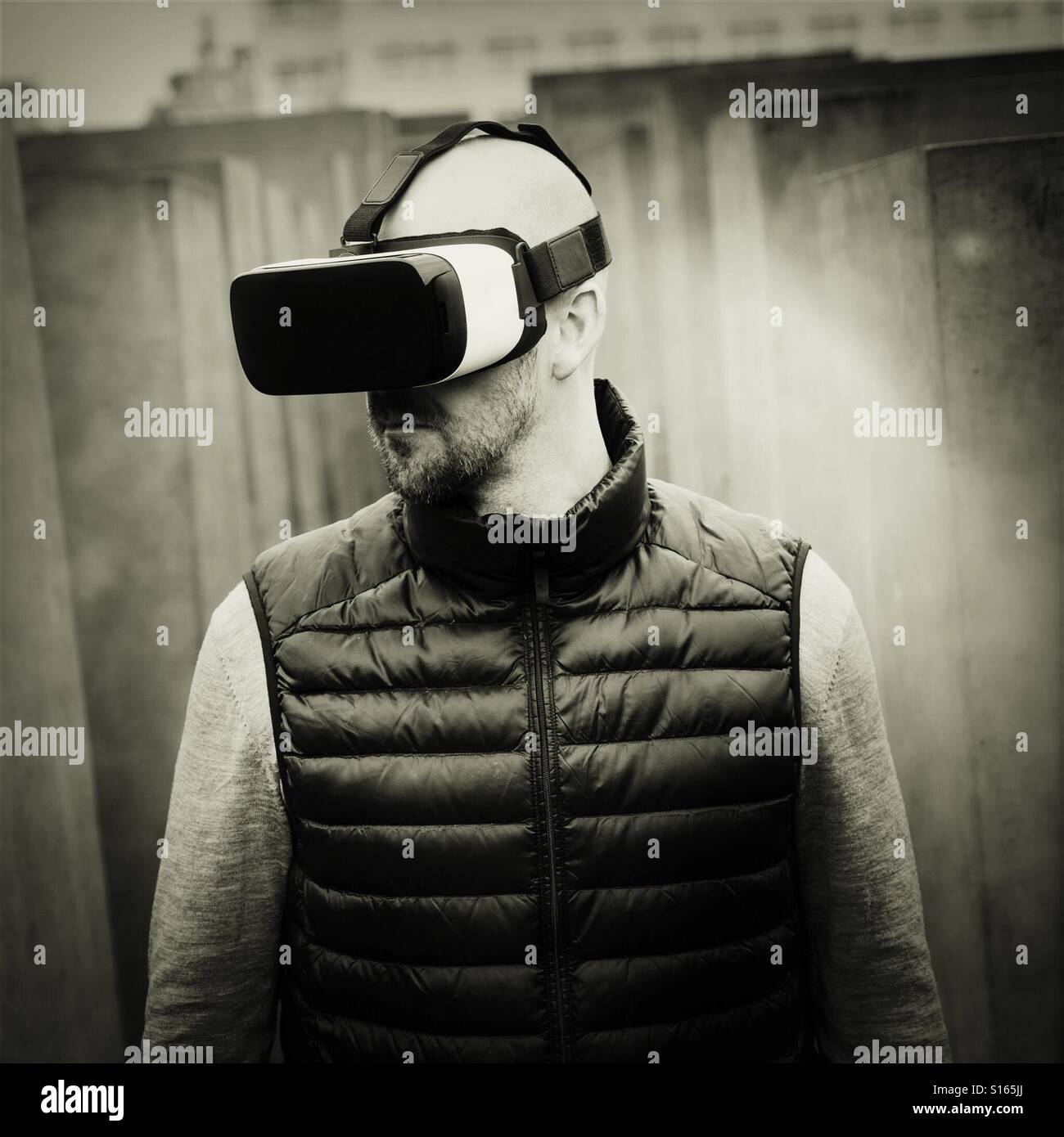 Man wearing VR virtual reality headset - Smartphone Captured Stock Image