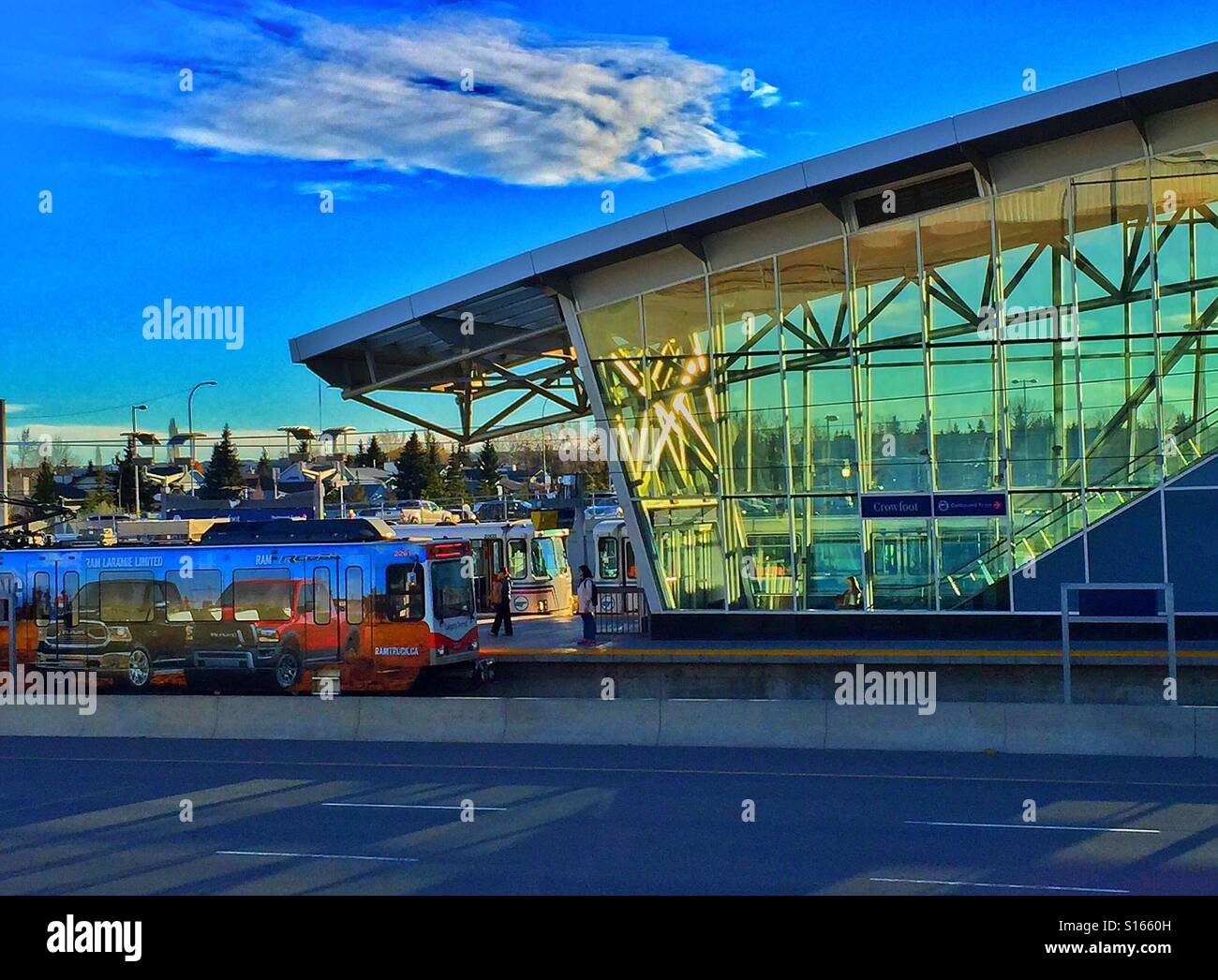Light rail transit station, bright sun and shadows across Crowchild Trail, Calgary, Alberta, Canada - Smartphone Captured Stock Image