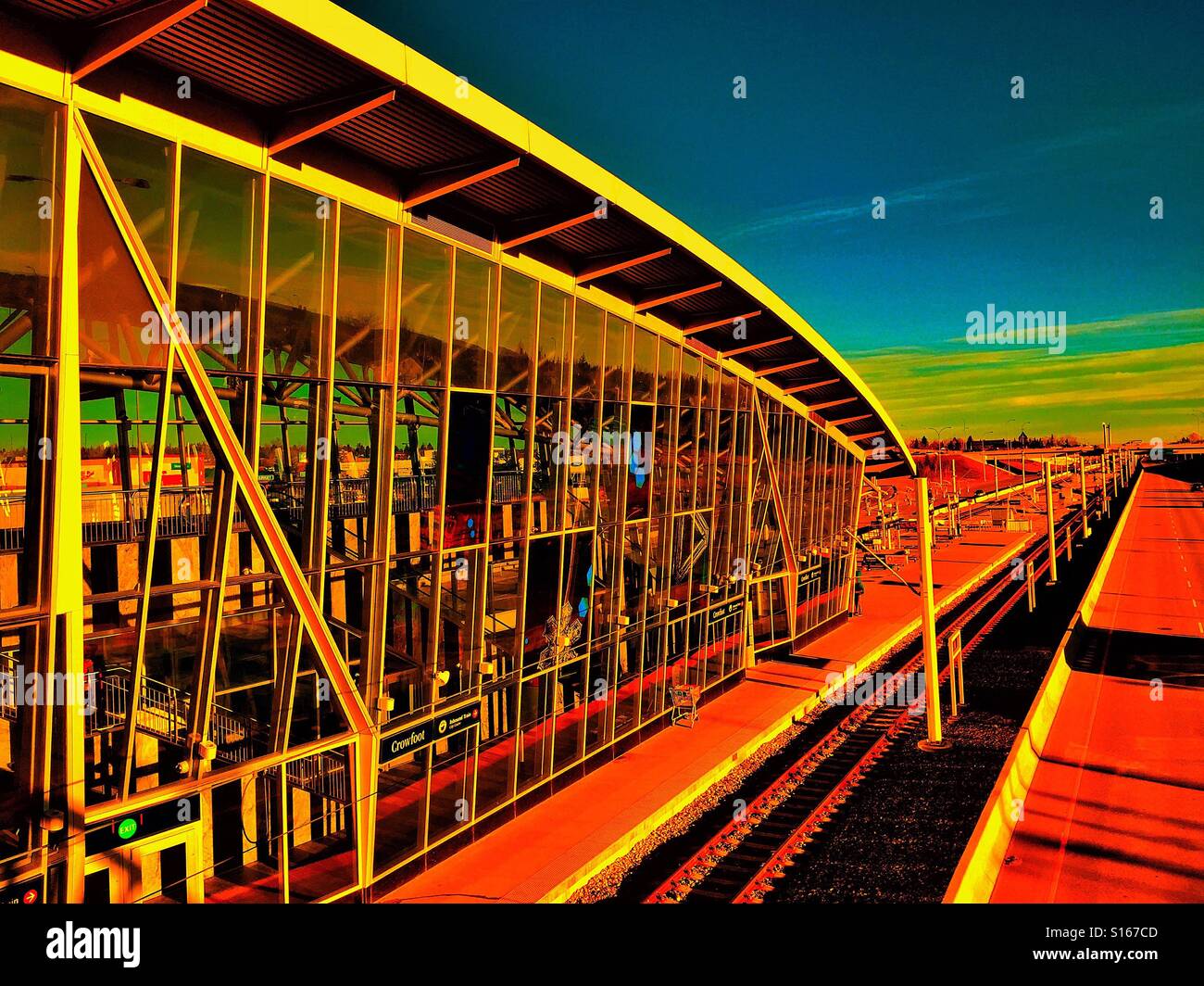 Light rail train station and track with late afternoon sun casting heavy shadows - Smartphone Captured Stock Image