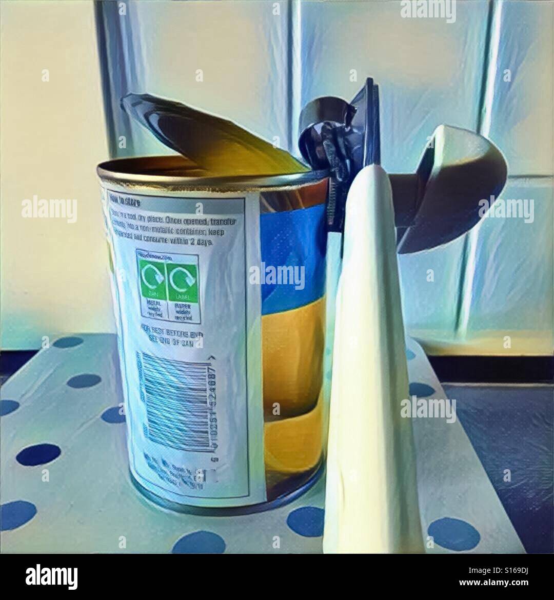 Tin of food being opened with can opener attached - Smartphone Captured Stock Image
