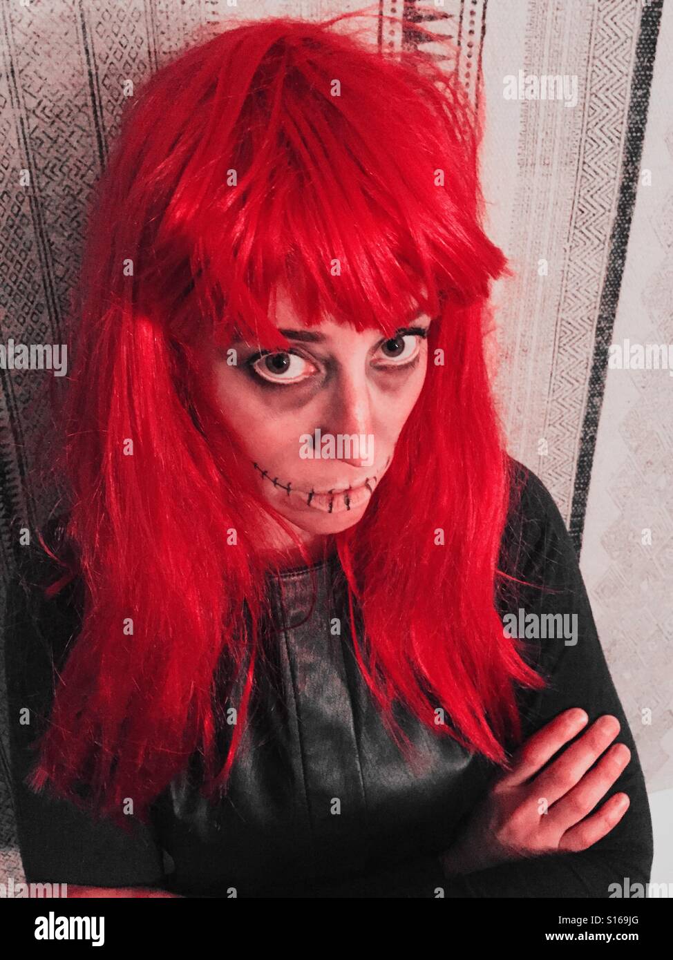 A woman with red makeup and a red face paint Image & Design ID 0000560726 
