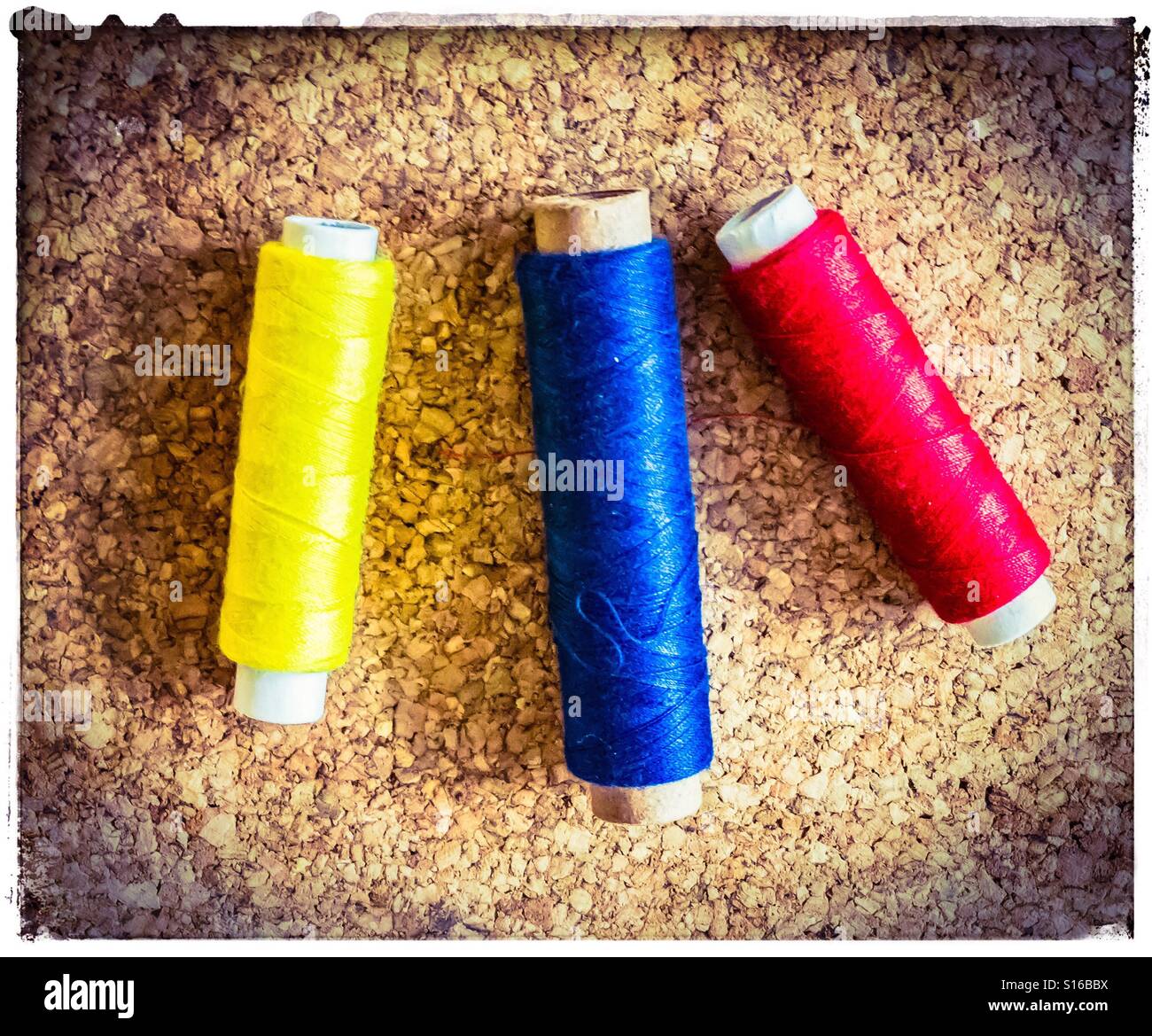 Three Different Rolls of Sewing Thread lie side by side Stock Photo Alamy