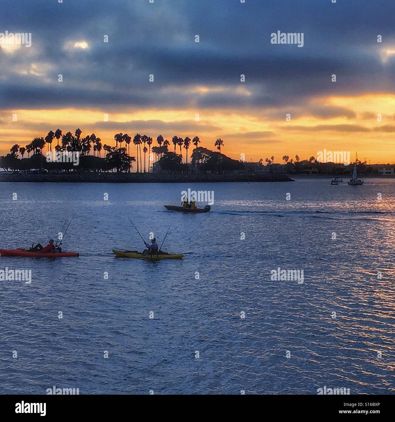 3 fishing boats and a sailboat San Diego Stock Photo Alamy
