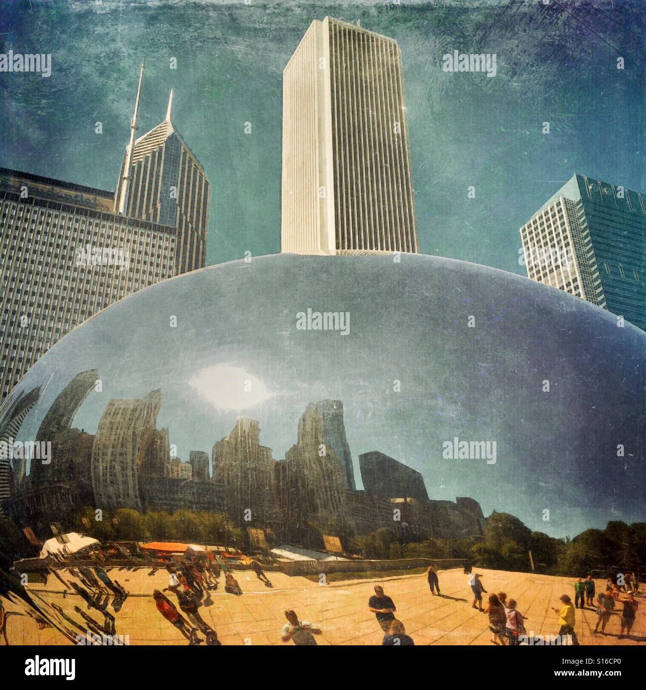 Skyline and tourists on a hot summer afternoon are reflected in Chicago's Cloud Gate, also called the Bean, in Millennium Park. - Smartphone Captured Stock Image