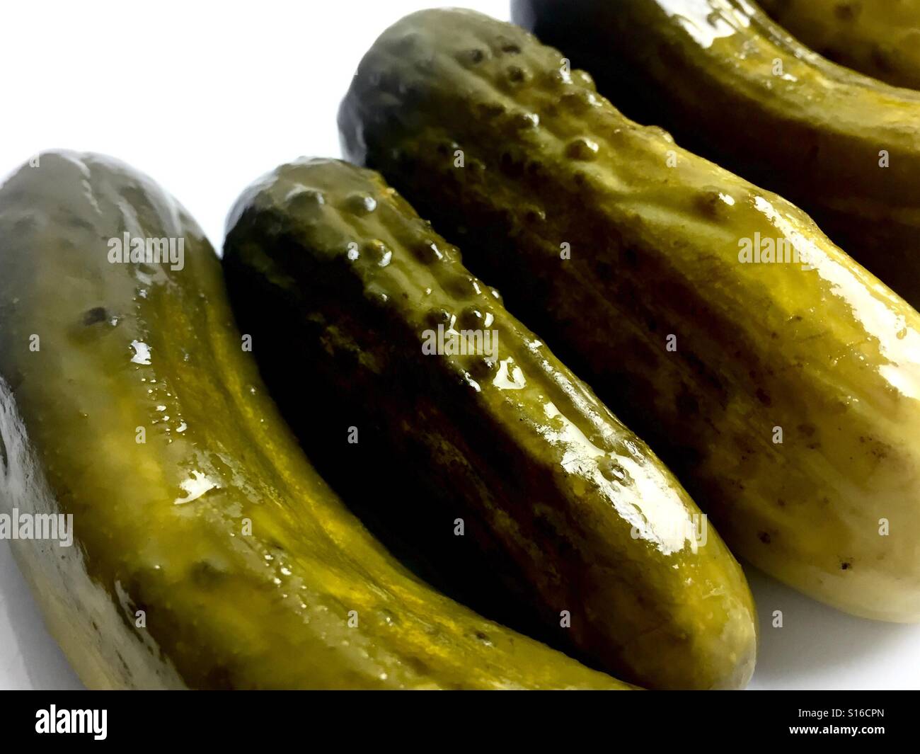 Dill pickles on a white plate - Smartphone Captured Stock Image