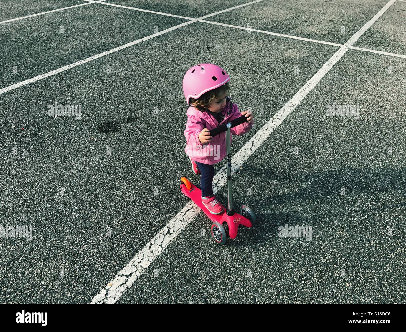 Toddler on scooter Stock Photo Alamy