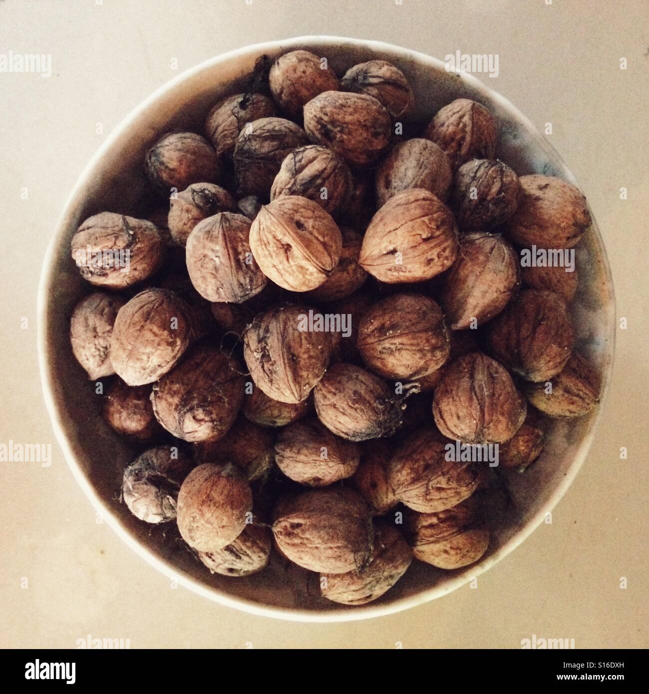 Bowl of small homegrown walnuts - Smartphone Captured Stock Image