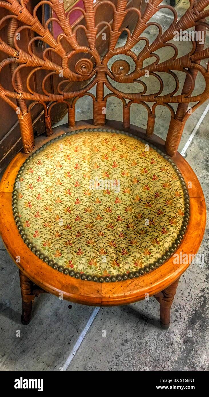 Antique wooden chair with flowers on the seat Stock Photo