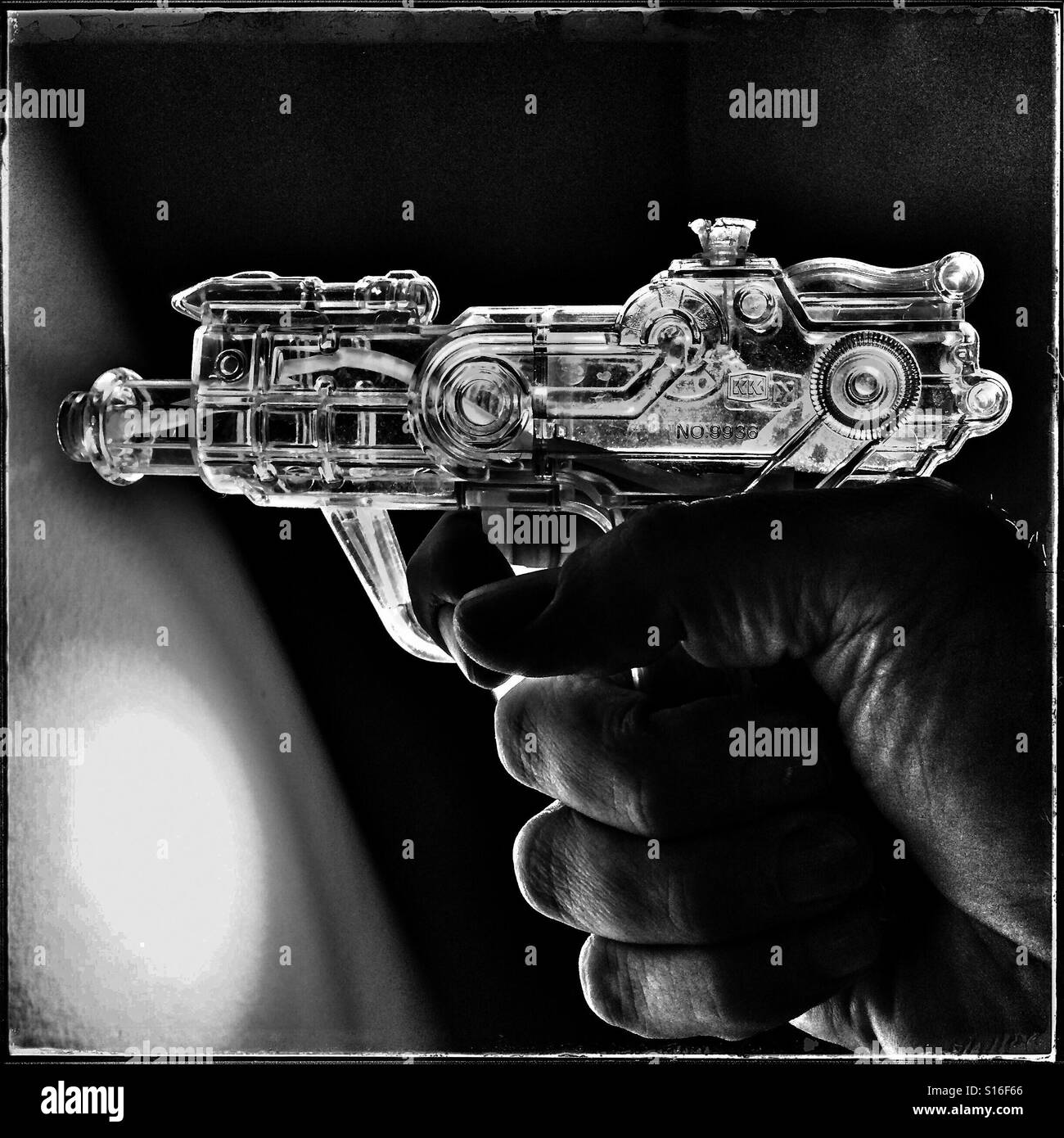 Transparent plastic water pistol - Smartphone Captured Stock Image