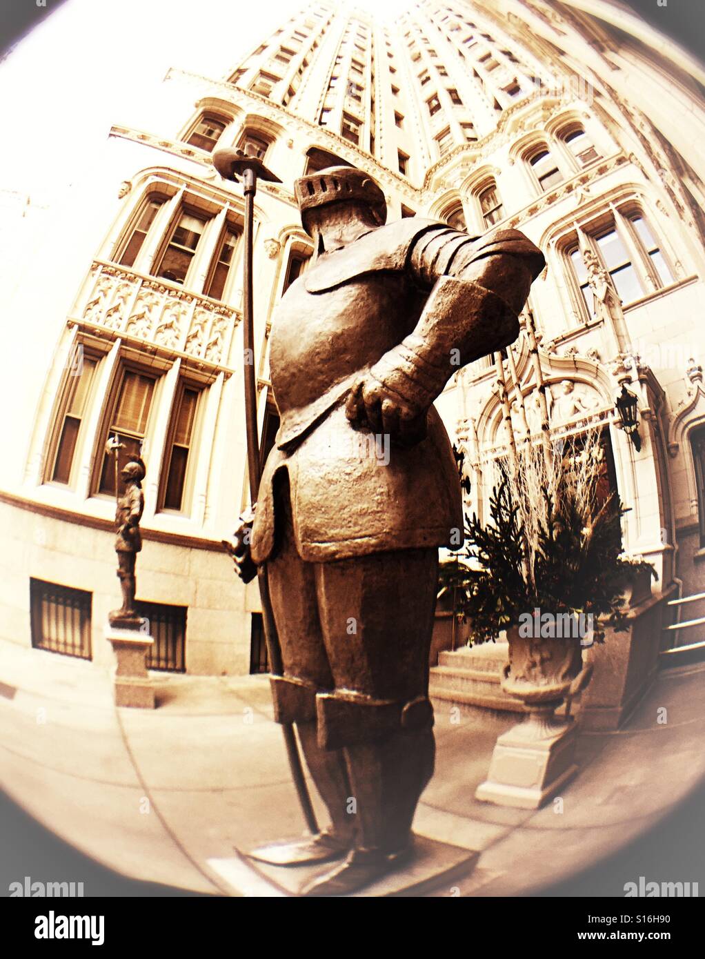 Fisheye lens view of two night in armor statues at an apartment building in New York City, USA - Smartphone Captured Stock Image