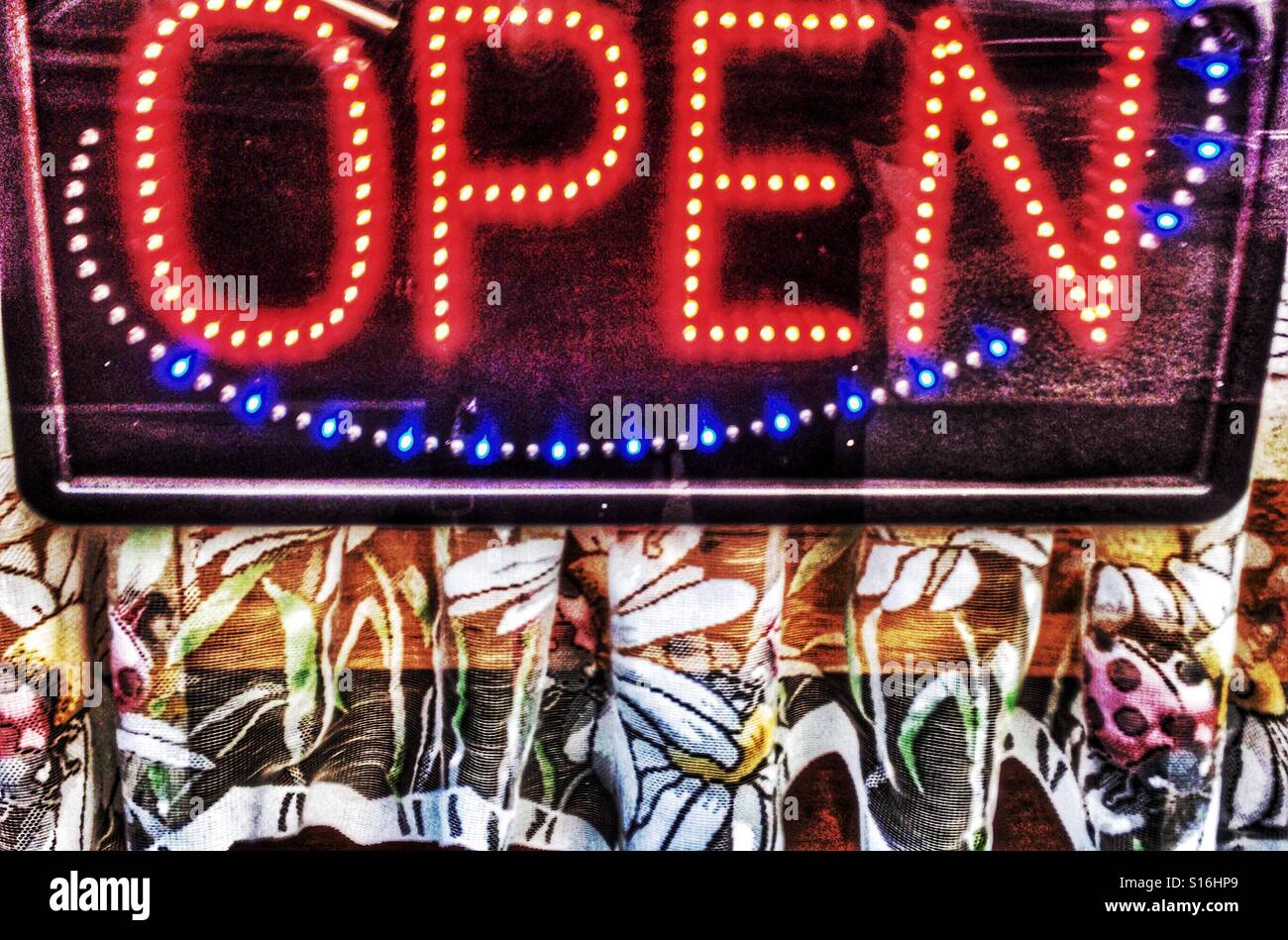 Illuminated open sign on window - Smartphone Captured Stock Image