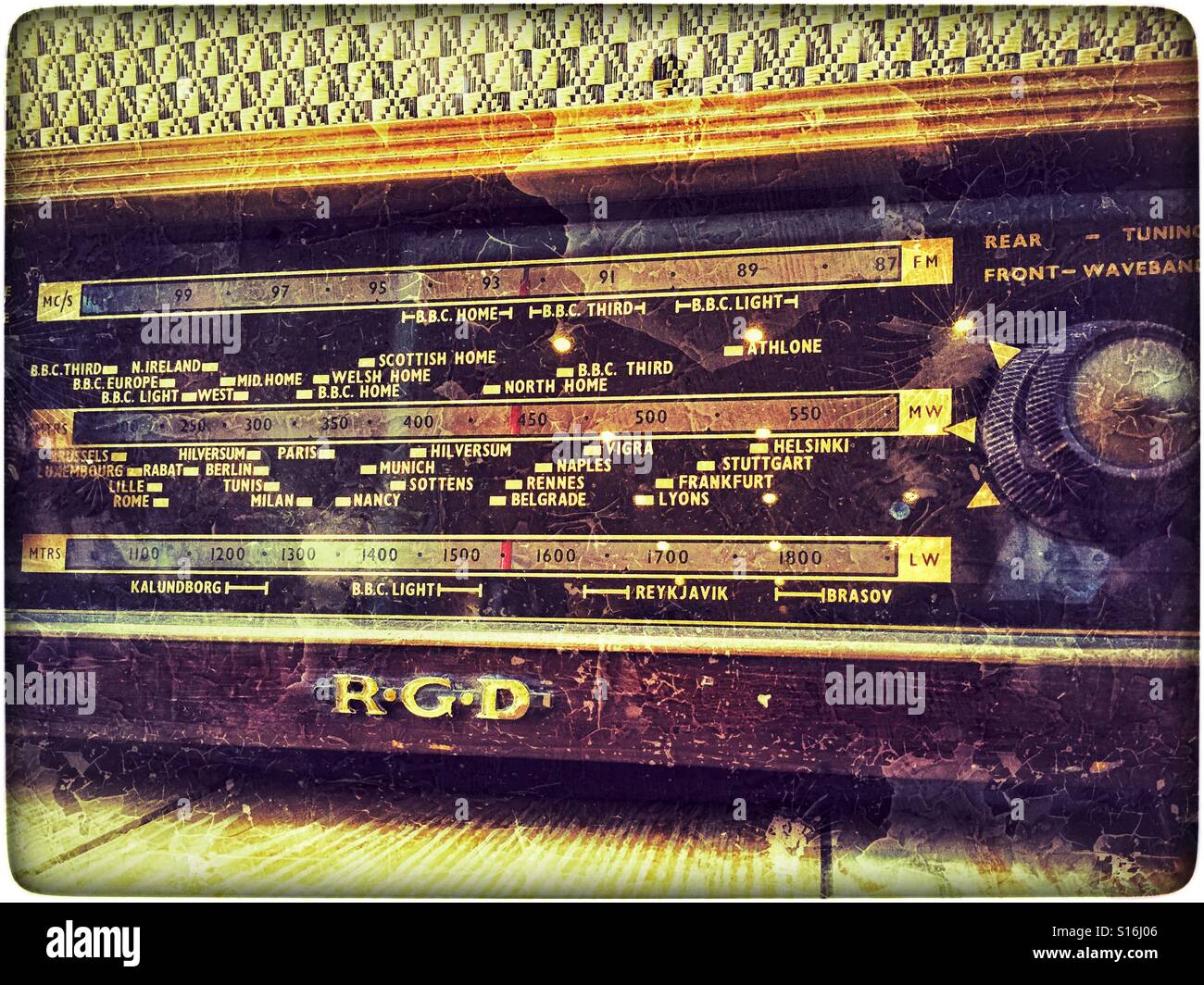 A grunge effect image of an old R.G.D valve radio. The location of BBC  Light and BBC Home Radio Stations are clearly marked, as are many European  Radio Stations. Photo Credit - ©