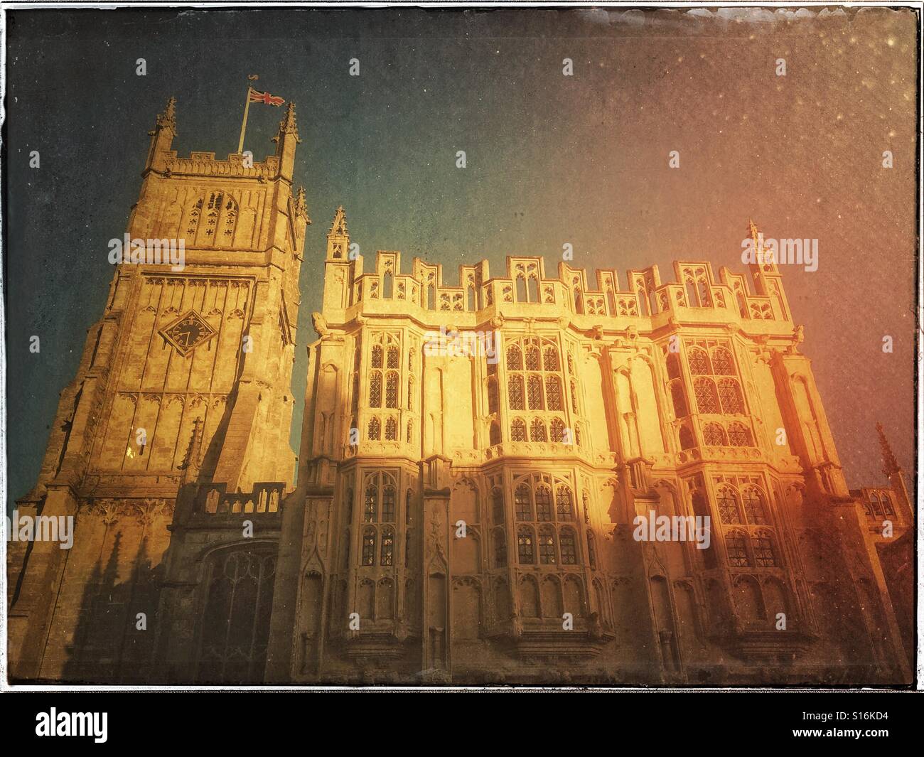 A Retro Effect picture of the Parish Church of St. John Baptist in Cirencester, Gloucestershire, England. The tower dates from the 15th Century. On the right is The Town Hall. Photo © COLIN HOSKINS. - Smartphone Captured Stock Image