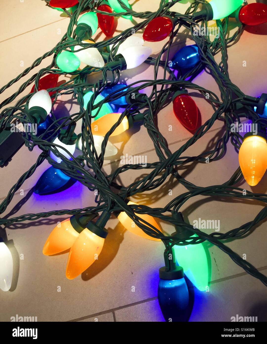 Strands of colorful holiday lights Stock Photo Alamy