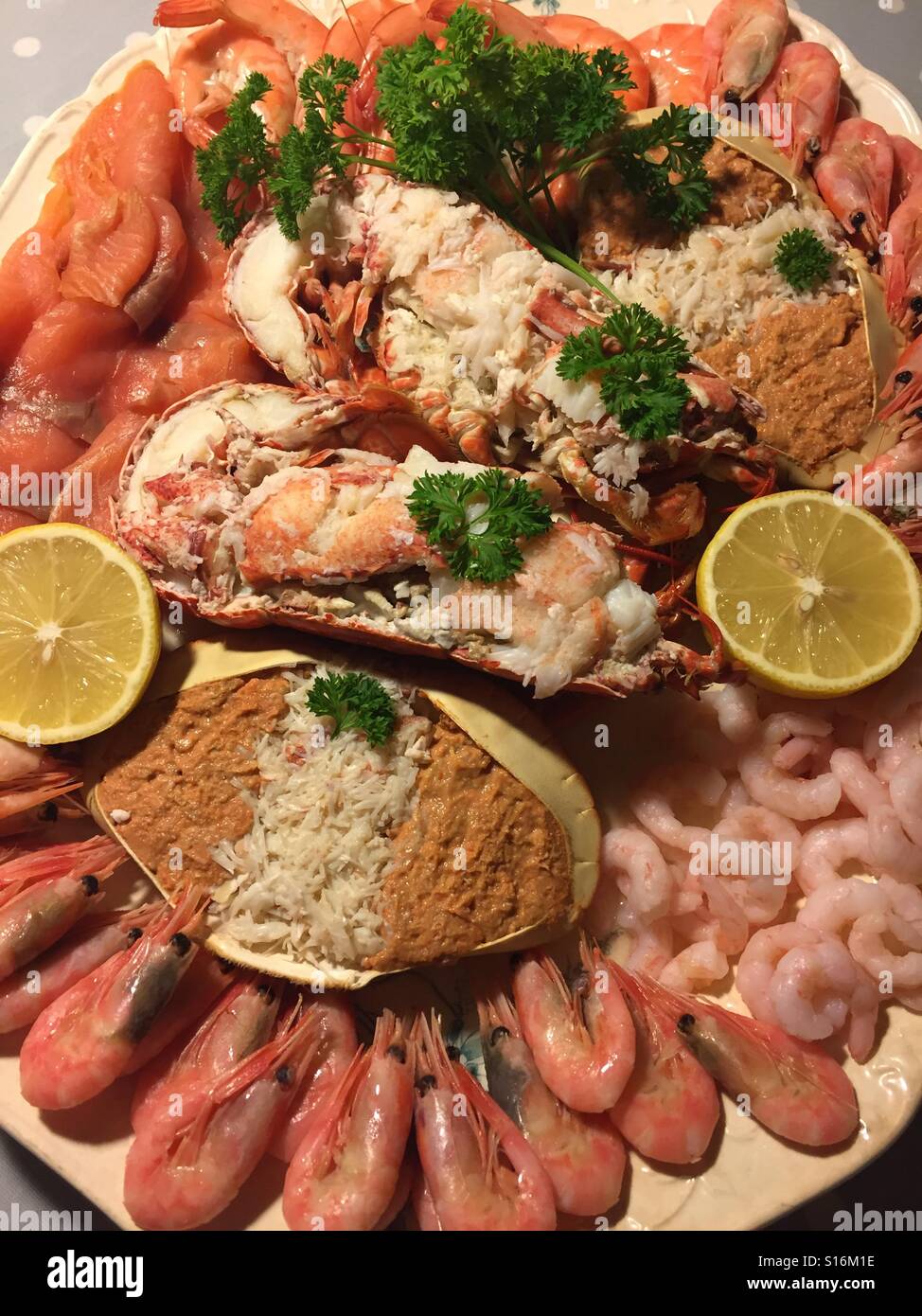 Luxury seafood platter. Dressed crab and lobster with smoked salmon and prawns of various types Stock Photo