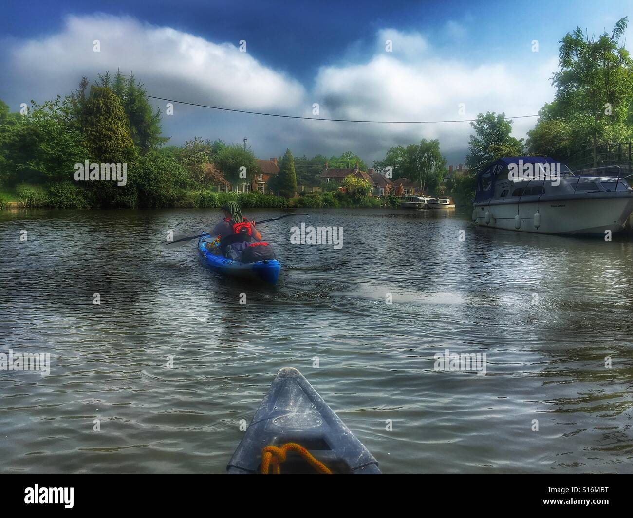 Canoeing down stream Stock Photo