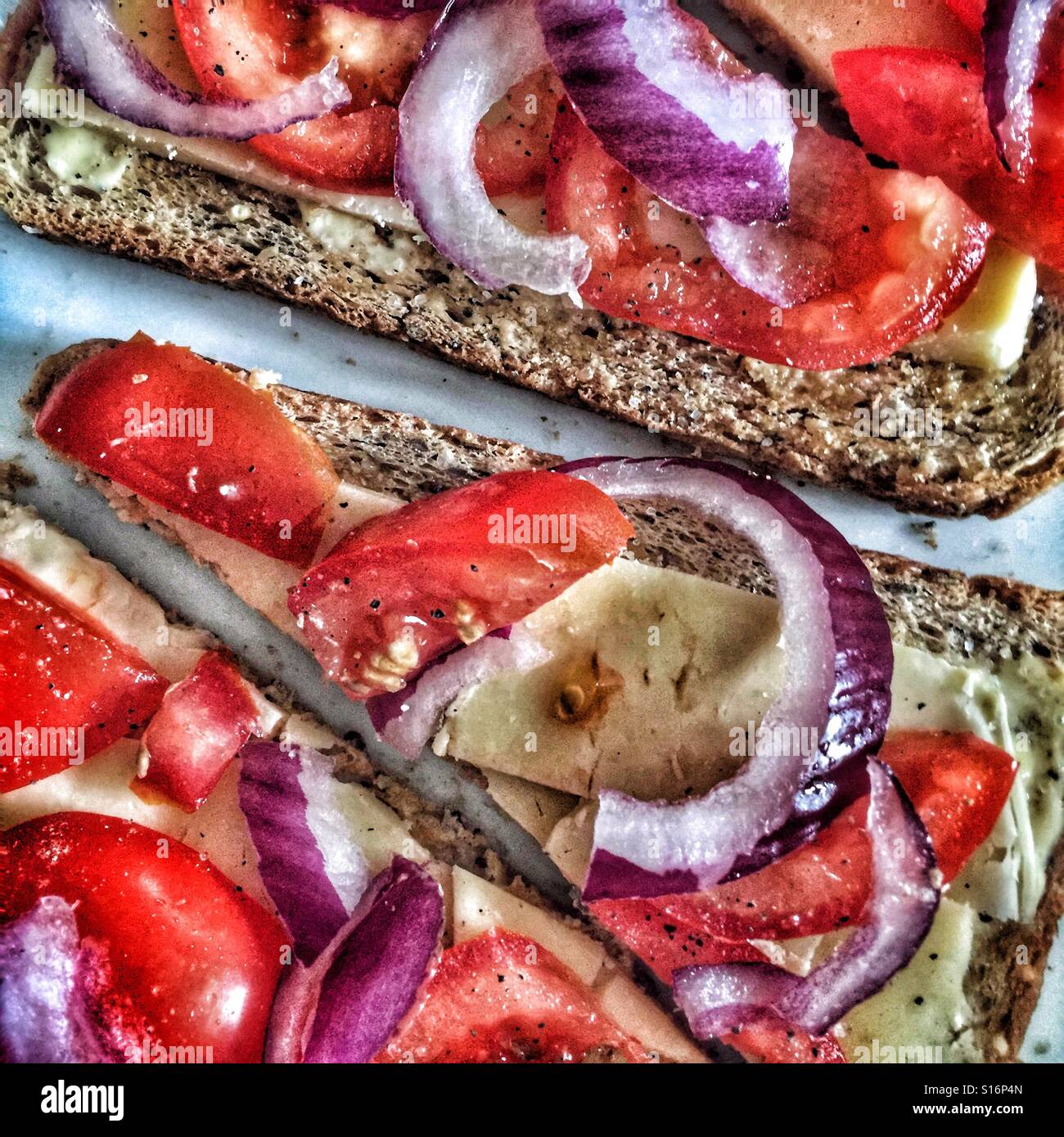 Cheese, onion and tomato on toast Stock Photo Alamy