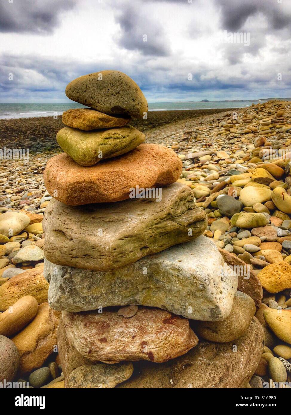 Rock sculpture on a pebble beach - Smartphone Captured Stock Image