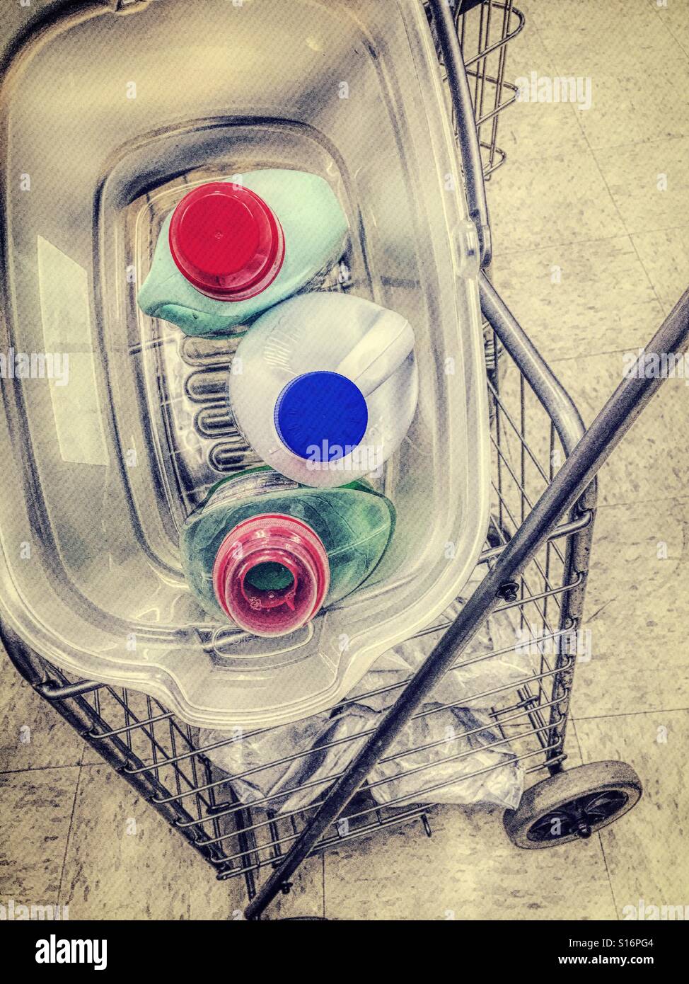 Laundry room pushcart has laundry detergent softener and bleach in the basket - Smartphone Captured Stock Image