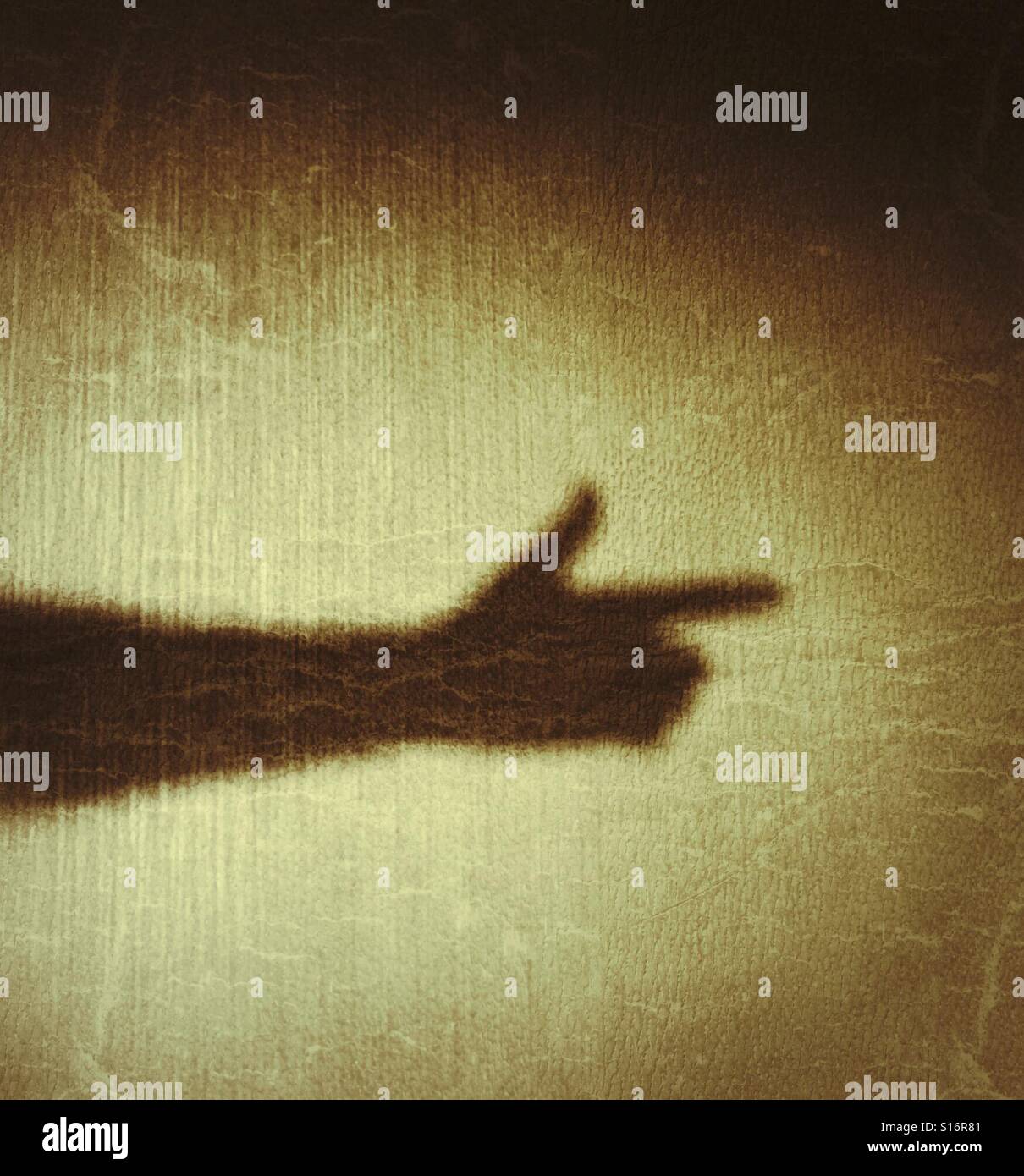 Shadow hand pointing like a Gun - Smartphone Captured Stock Image