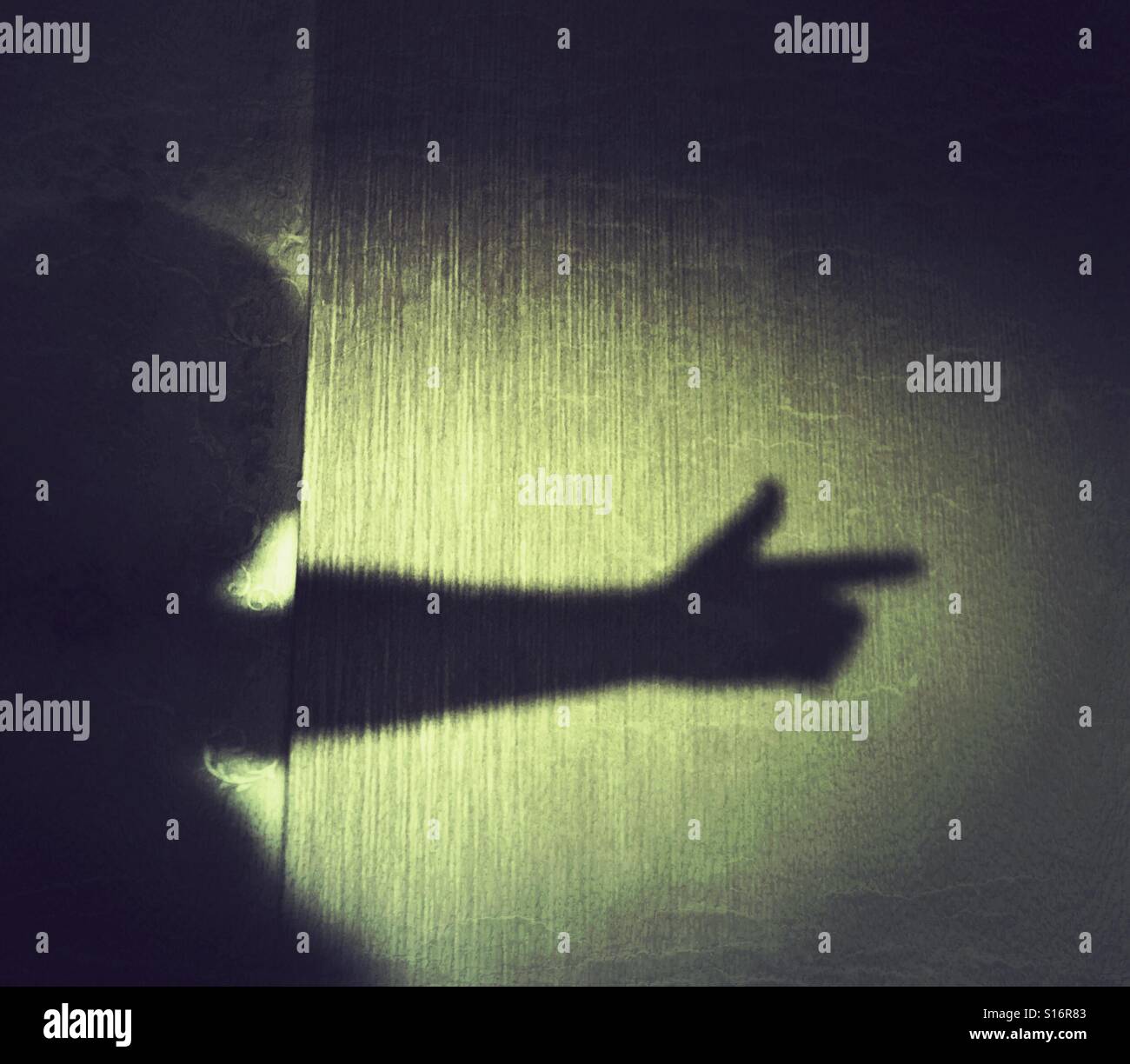 Man shadow pointing hand like a gun - Smartphone Captured Stock Image