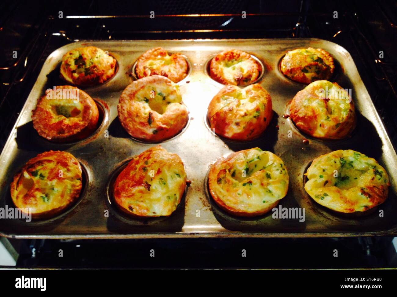 Yorkshire puddings in oven Stock Photo Alamy