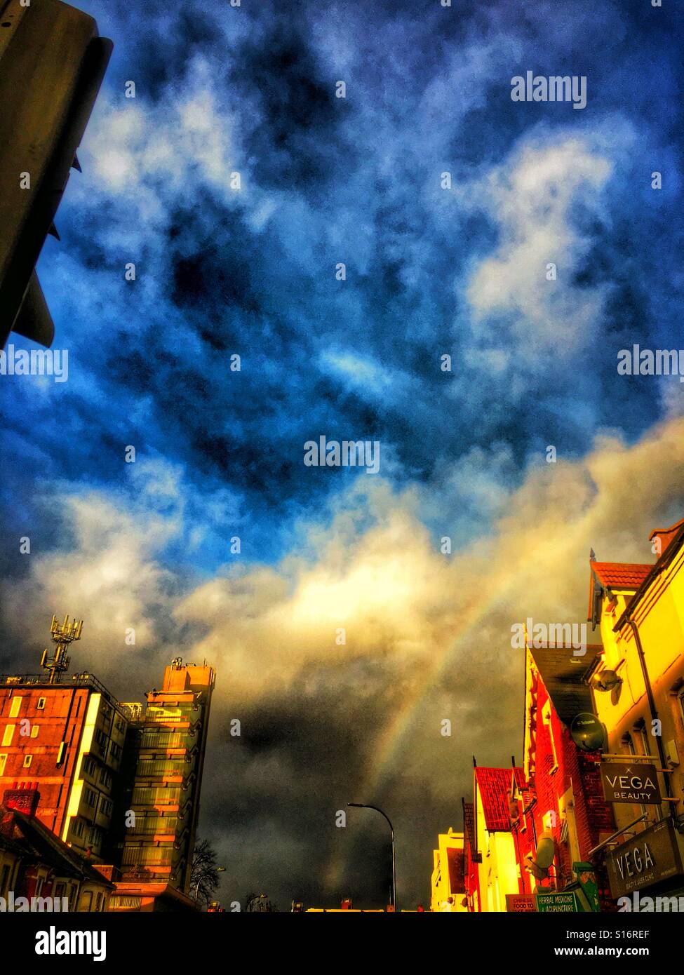 Blue sky and rainbow Stock Photo - Alamy
