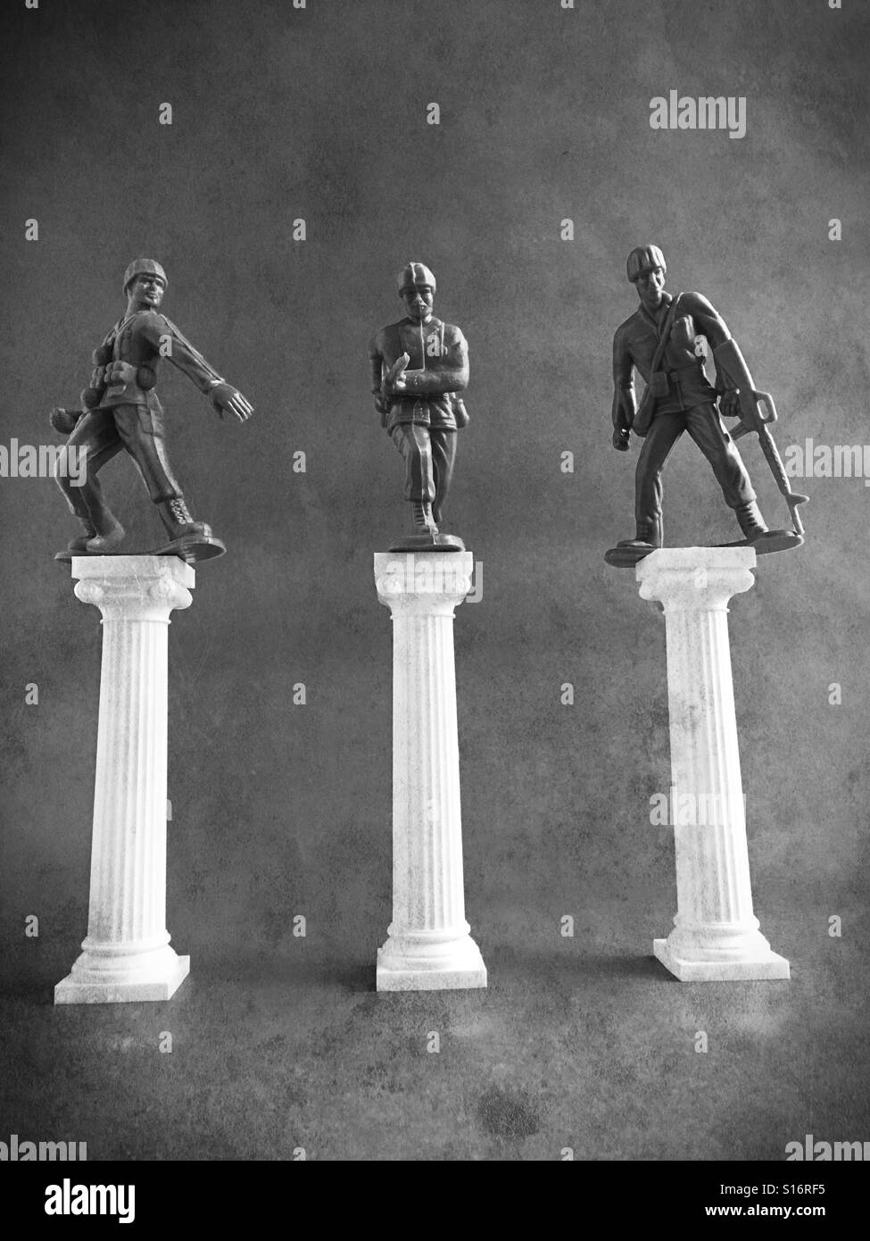 Toy soldiers on pedestals. Stock Photo