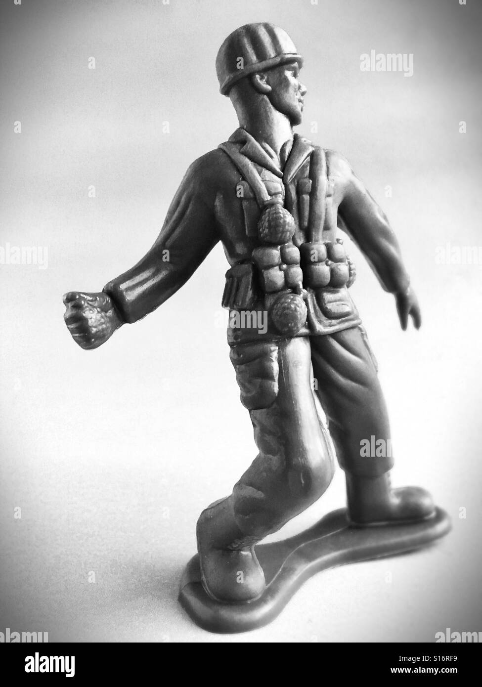 A toy soldier holding a hand grenade. Stock Photo