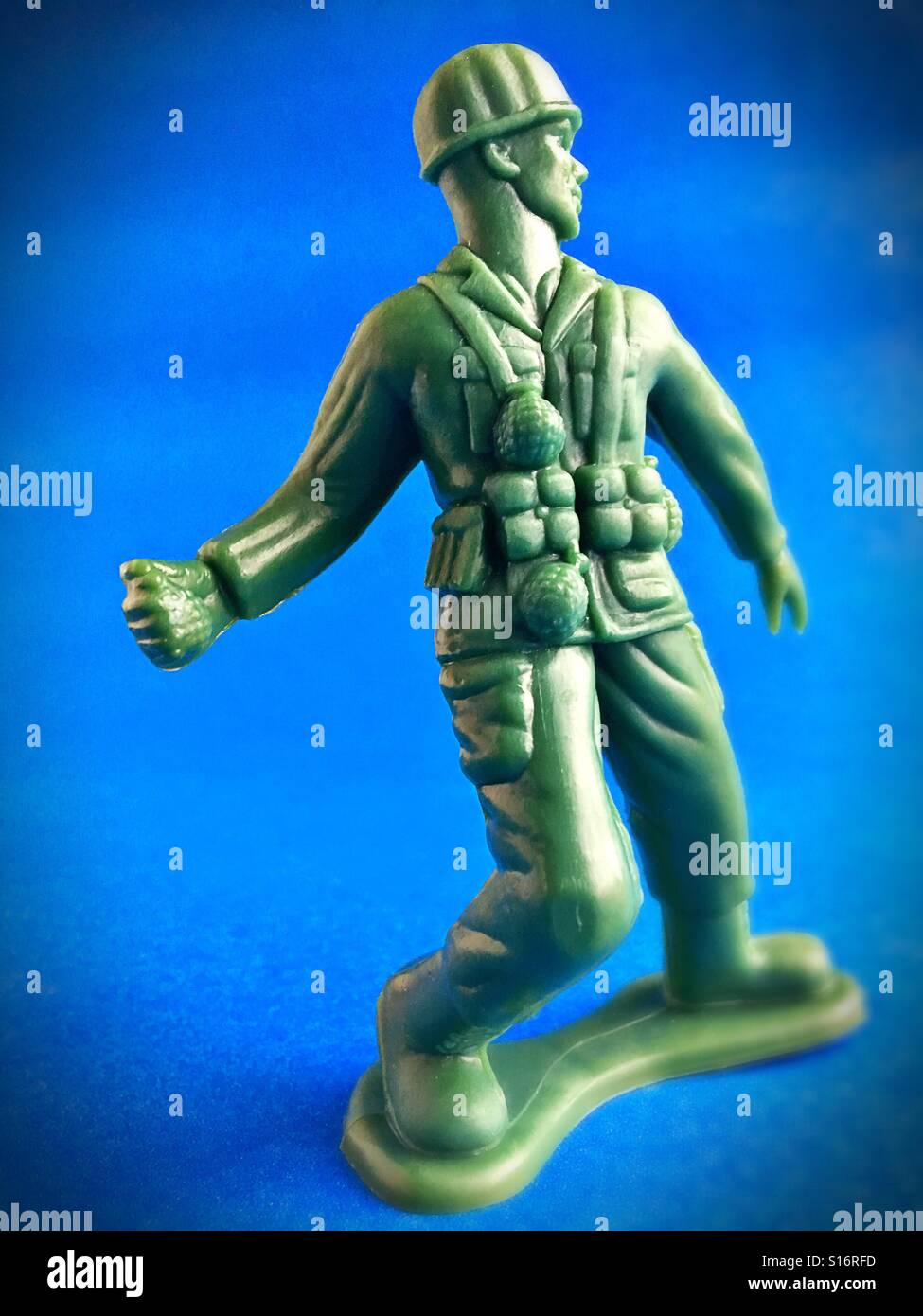 A toy soldier holding a hand grenade. Stock Photo