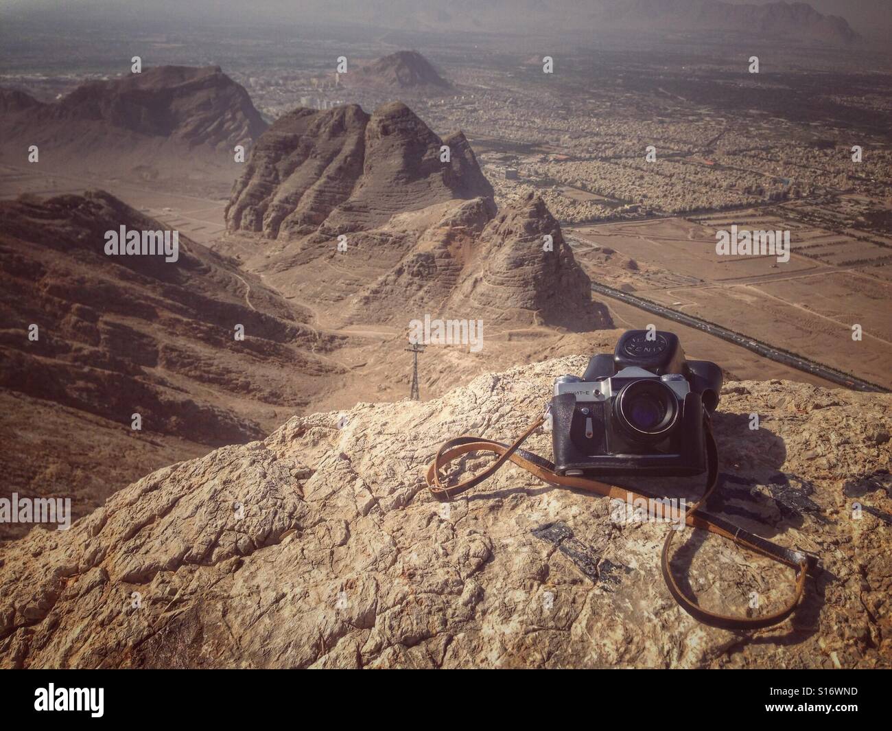 Analog camera in front of mountain view, Iran - Smartphone Captured Stock Image