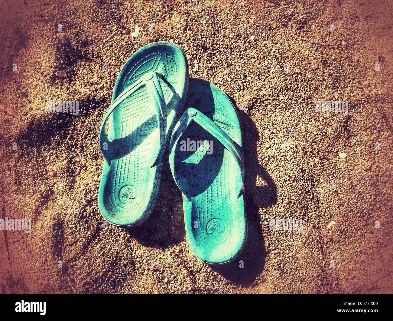 Flip flops on the beach Stock Photo - Alamy