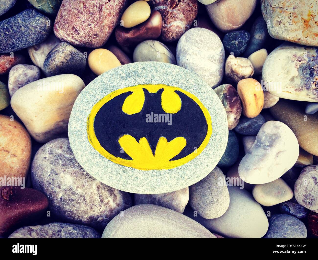 Painted on a stone sign Batman with stones background Stock Photo