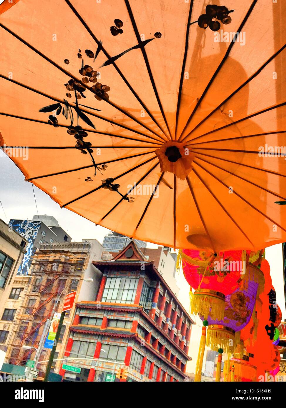 A bright orange decorative lantern in Chinatown NYC. - Smartphone Captured Stock Image