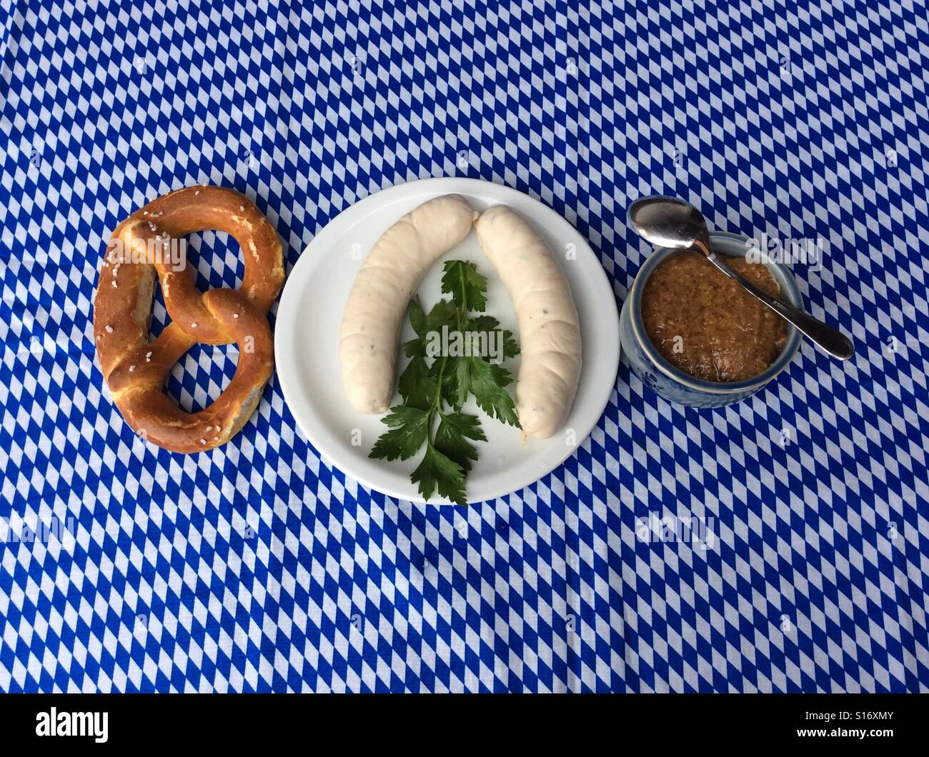 Weisswurst and pretzel for traditional breakfast in Bavaria, Germany, Europe Stock Photo