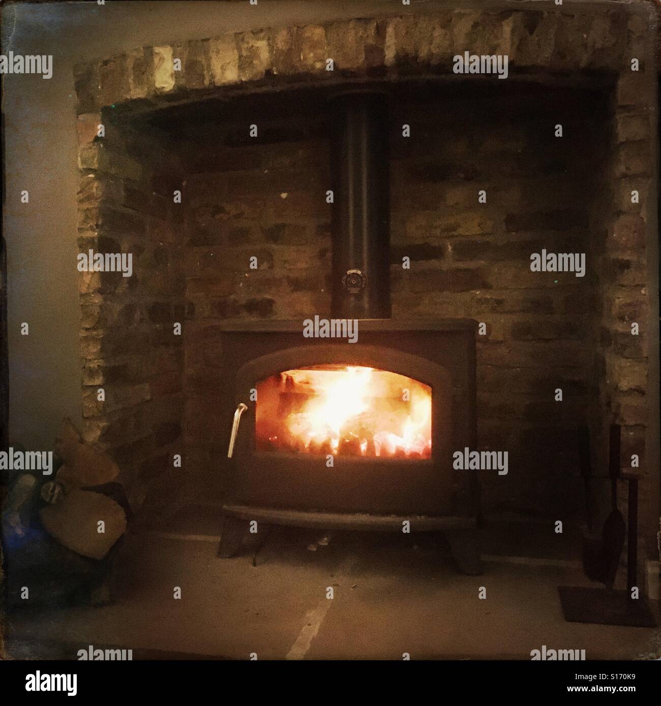 Wood burning stove in a living room Stock Photo