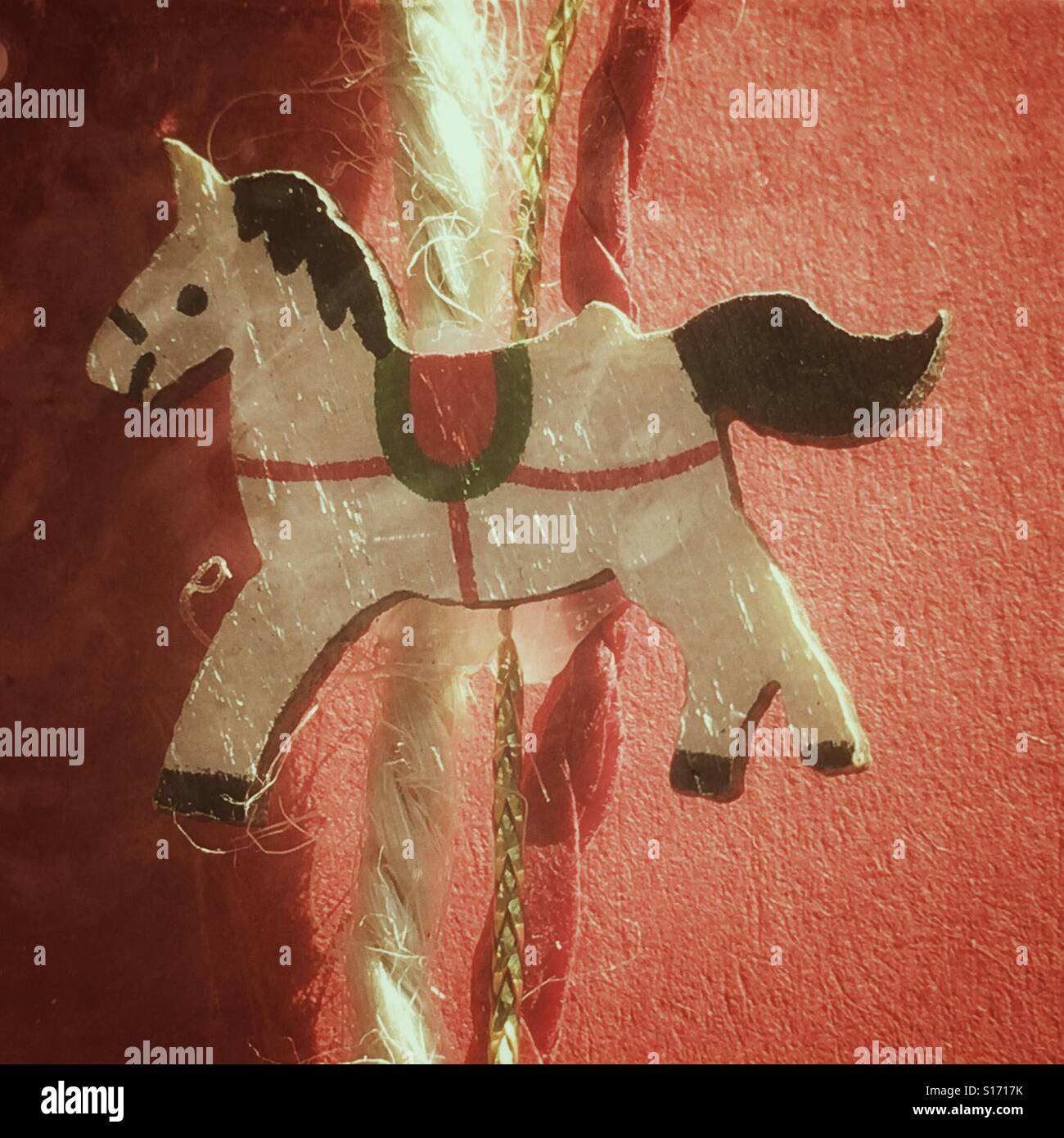 String decorated with a small wooden horse, an alternative to ribbon - Smartphone Captured Stock Image