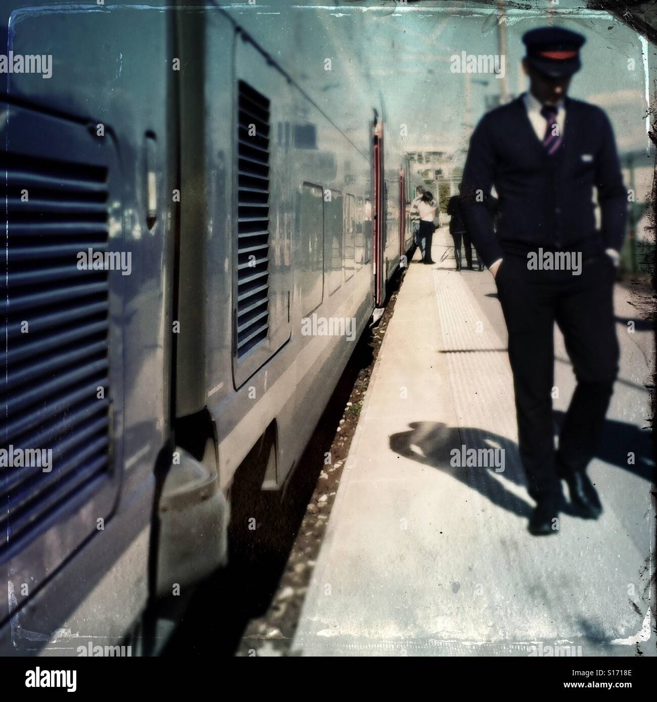 Train conductor waits for passengers to board - Smartphone Captured Stock Image