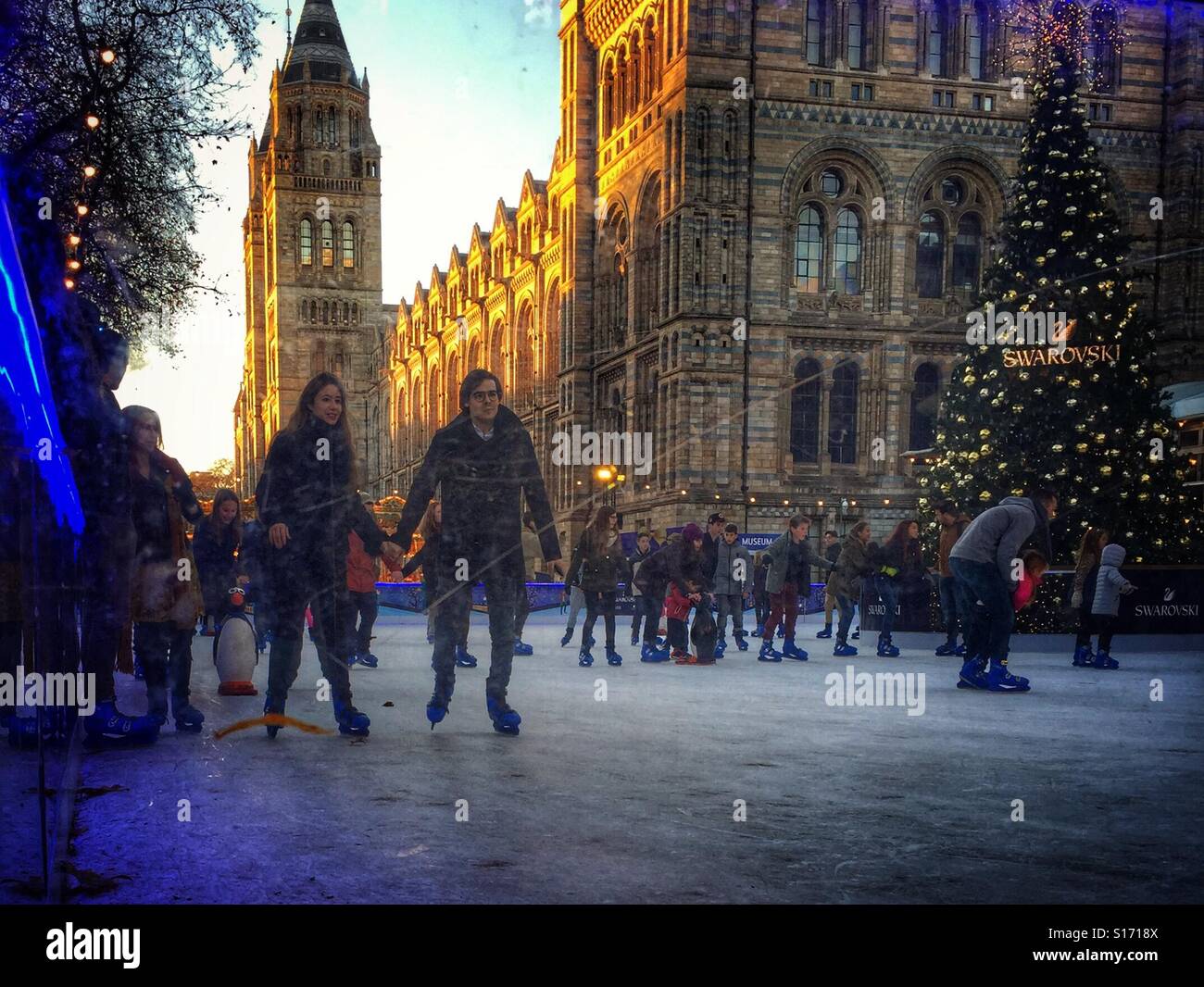 Skating at the National History Museum ice rink, London - Smartphone Captured Stock Image