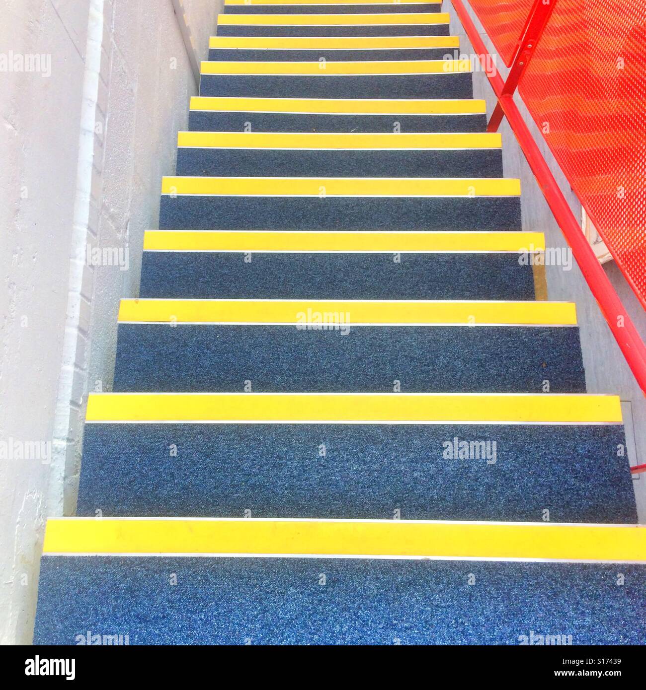 Stairway with bright yellow safety  warning strips Stock Photo