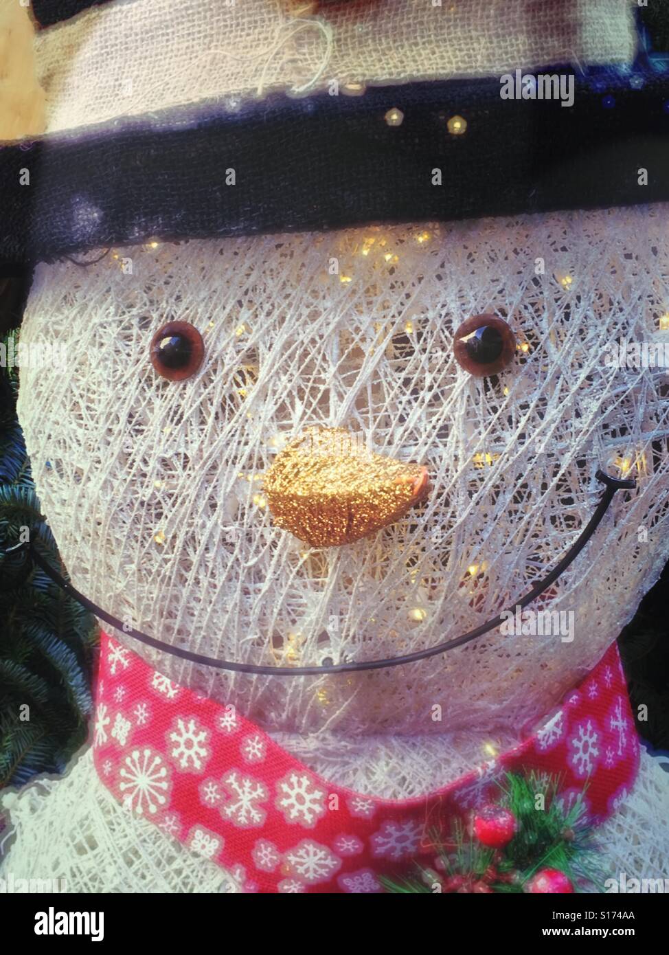 Close up of cheerful snowman holiday decoration, USA - Smartphone Captured Stock Image