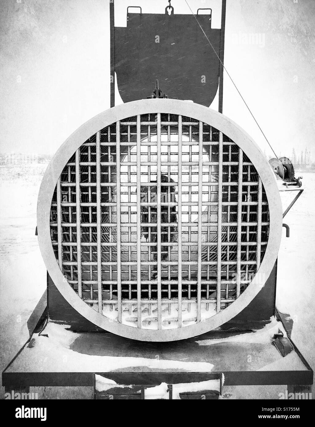 a polar bear trap, baited with seal-oil-soaked canvas, stands in Churchill, Canada. - Smartphone Captured Stock Image
