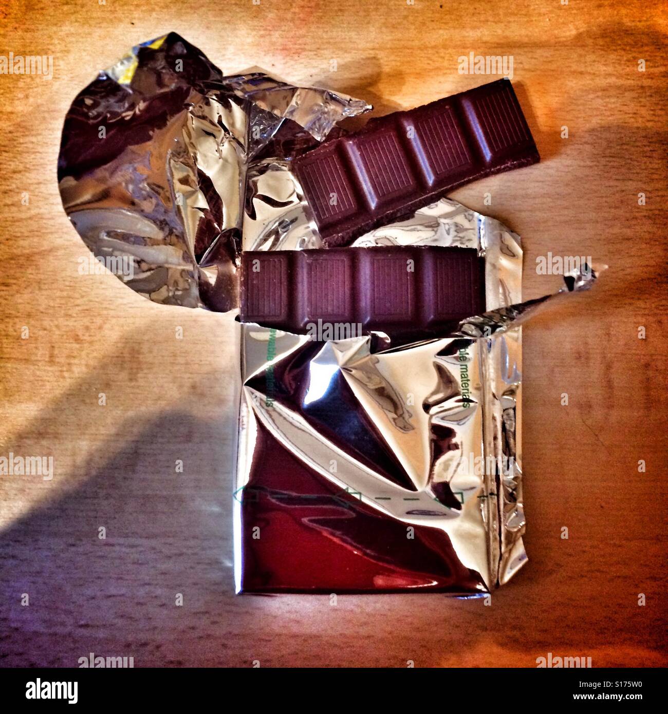 Dark chocolate in torn foil wrapper - Smartphone Captured Stock Image
