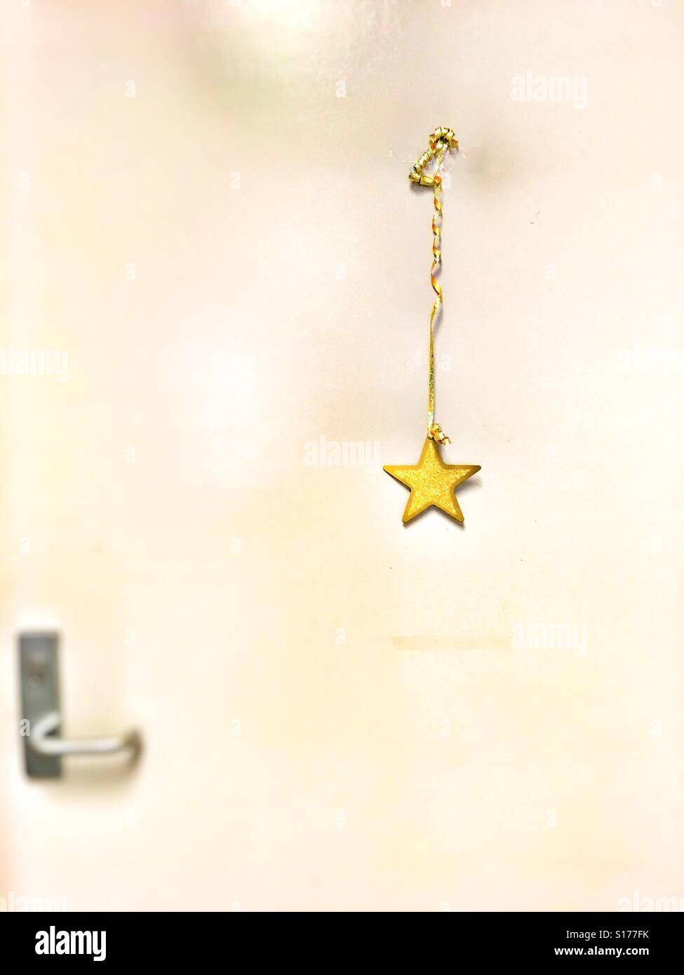 Christmas star on a door. - Smartphone Captured Stock Image