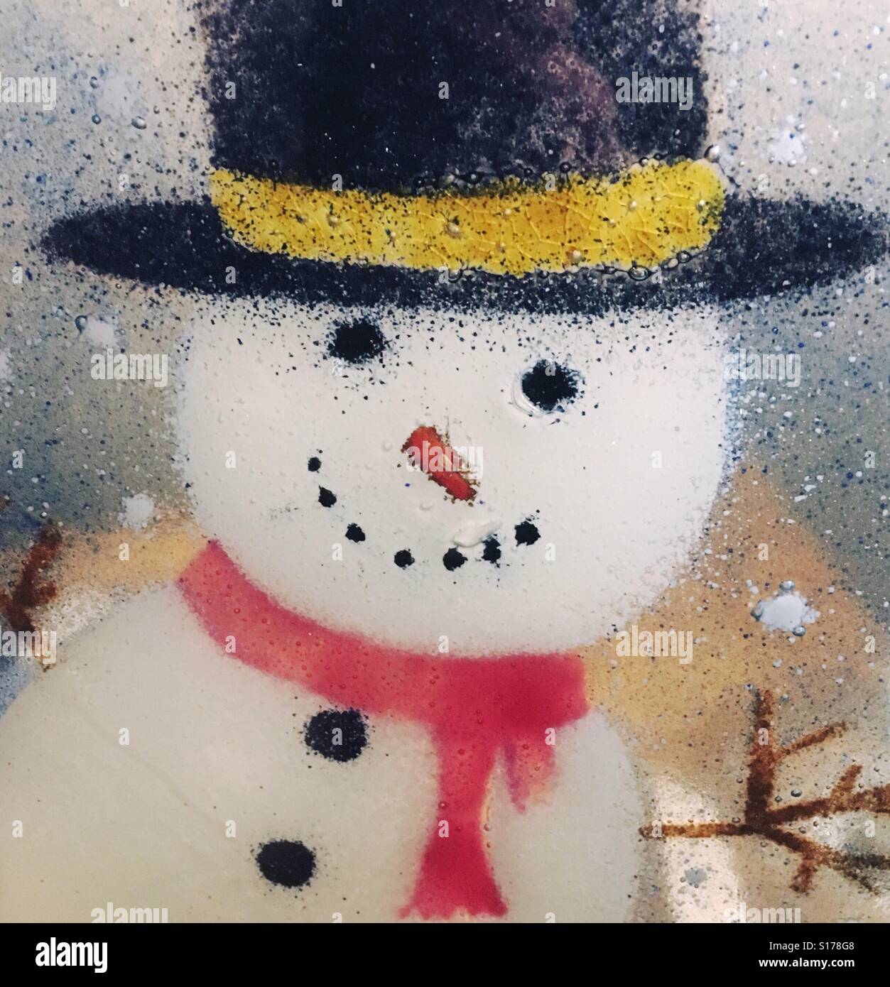 Painted snowman in glass - Smartphone Captured Stock Image